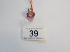 A 9ct gold heart cut pink topaz pendant