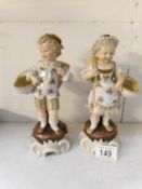 A pair of late 19th century boy and girl figures