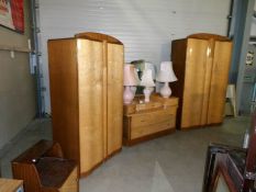 A 1960's birds eye maple bedroom suite comprising 2 wardrobes, dressing table,