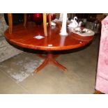 A circular pine dining table