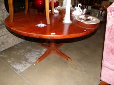 A circular pine dining table