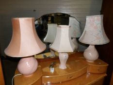 A pair of table lamps and one other
