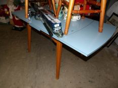 A formica topped drop leaf table
