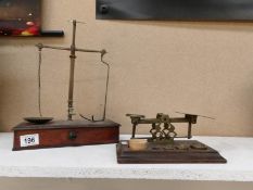 A Set of Victorian brass postal scales and a set of Victorian brass apothecary scales,