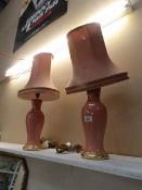 A pair of pottery table lamps with shades