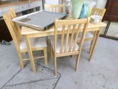 A kitchen table and 4 chairs