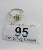 A 9ct gold ring set peridot and diamonds,