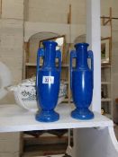 A pair of blue pottery vases