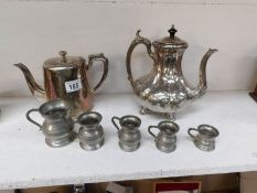 A set of 5 pewter measures and 2 silver plated teapots