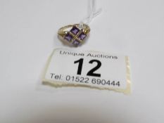 A 9ct gold ring set 4 fine amethyst stones,