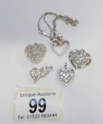 2 silver hearts on chains and 3 other hearts