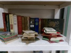 A collection of old books including poetry,