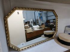 A gilt framed mirror