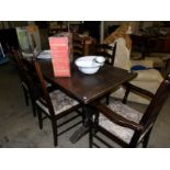 An oak refectory table and 6 chairs