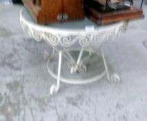 A wrought iron glass topped table