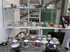 A large collection of tea cups and saucers including Wedgwood,