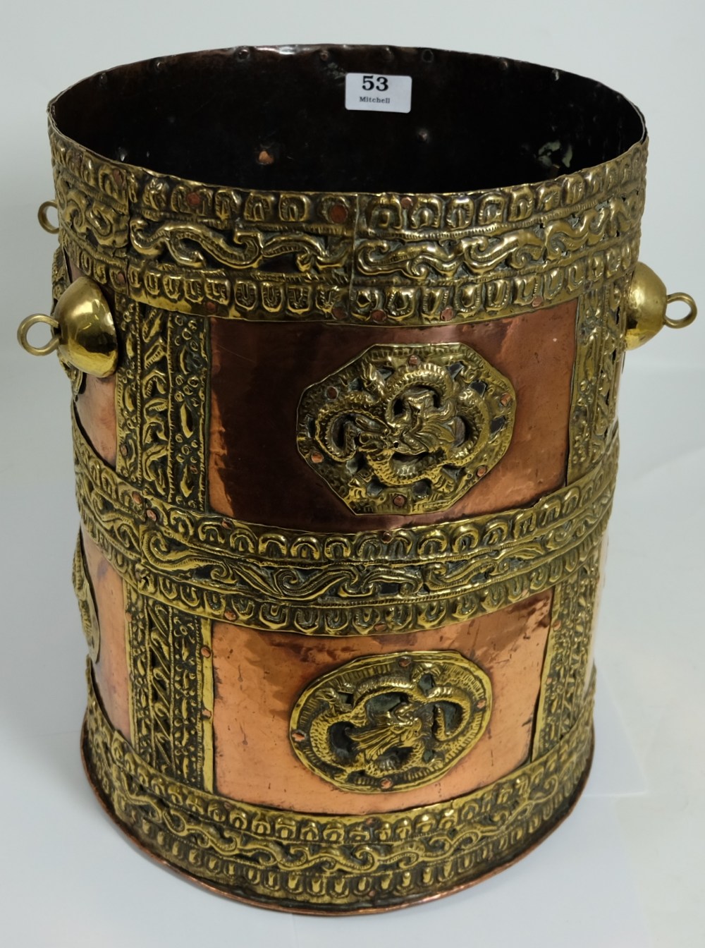 Persian Copper Urn, brass bound/overlaid in high relief, with carrying mount, 15”h x 11”w.