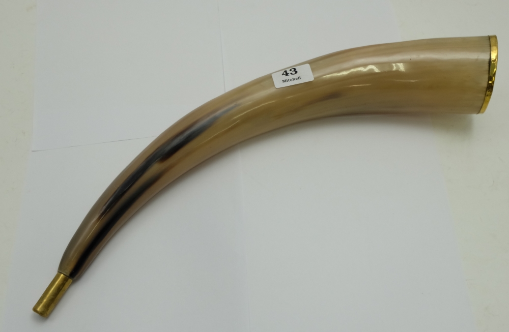 Bone Ear Horn, with brass mouthpiece and brass rim.