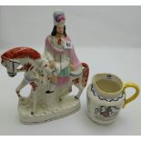Royal Doulton Jug, inscribed with English rhymes & a coloured Staffordshire Horseback figure.