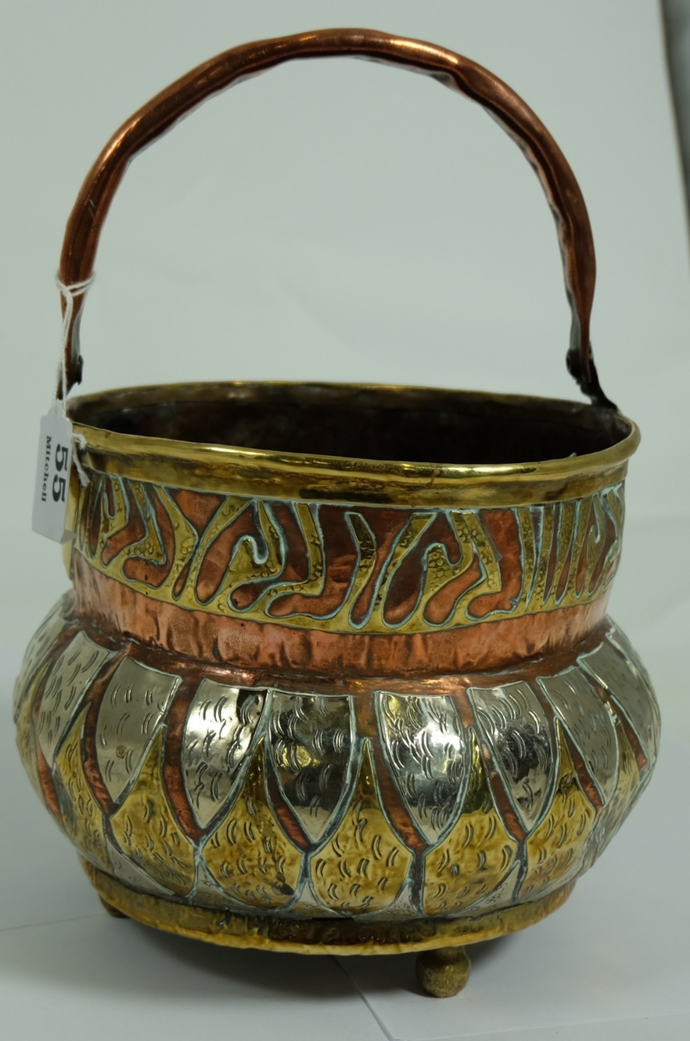 Oriental copper and brass pot with carrying handle, on 3 bun feet, 6”h & 2 beaten copper Jugs.