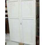 Cream painted mahogany two door Press/Wardrobe, with carved door panels (no base or pediment), 49”w