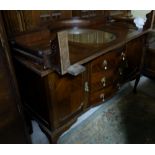 Early 20thC Walnut Sideboard, the gallery back fitted with an oval bevelled mirror, 73”h x 57.5”w.