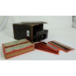 Victorian Magic Lantern in a metal case and 3 bundles of magic lantern slides “Tales with Texts”.