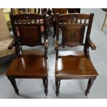 Matching Pair of Mahogany Carver Hall Chairs, with spindle inserts over carved back panels, on