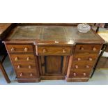 Victorian Mahogany Writing Desk, with central frieze drawer and 4 drawers on either side, turned