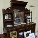 Edw. Walnut Sideboard with mirror back, carved panels with arrangement of shelves, over 3 drawers, 4