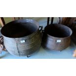 Two Irish metal skillet pots, incl. one 14 gallons, each raised on 3 feet.