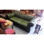 Three Seater Green Leather Chesterfield Couch, the roll top inset with button details, 77“w x 34“