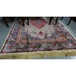 Kashmir Floor Rug, red and ivory ground with central medallion, 4ft x 5ft6”.