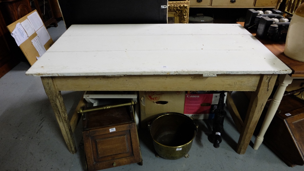 Antique Pine Kitchen Table, the painted white top, over a stripped base, 29.5”h x 57”w x 32”d.