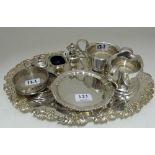 Group of silver plate – sugar bowl and matching cream jug, condiment set, bottle stands & 2 trays (