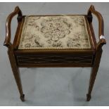 Edwardian inlaid mahogany piano stool, the hinged compartment lid covered with padded seat, on