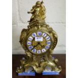 French 19thC Ormolu Mantle Clock, the ornate floral encrusted case mounted with study of cherub