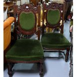 Matching Pair of large Mahogany Hall Chairs, the carved top rails over oval green velour padded