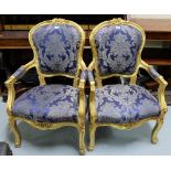 Matching Pair of gilt decorated Armchairs, with curved top rails, on cabriole legs, blue floral