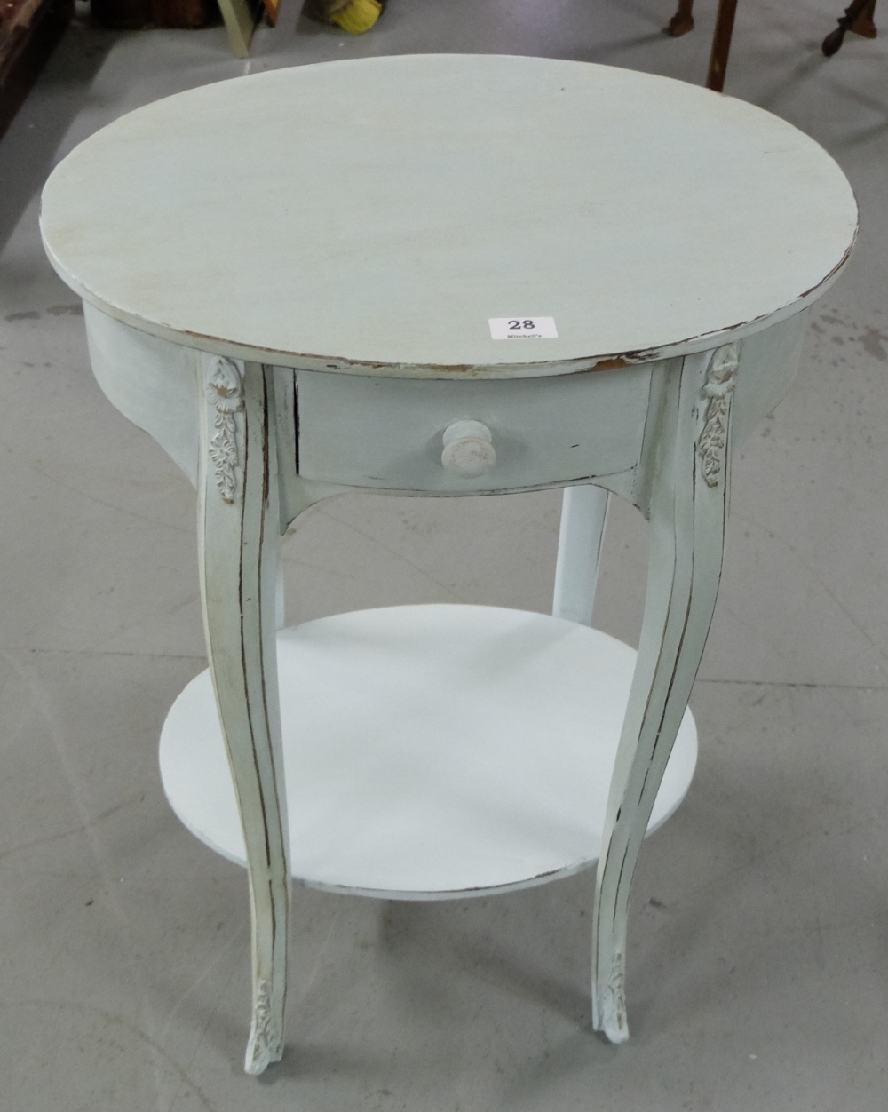 Modern oval topped occasional table, with central drawer, over cabriole legs with stretcher shelf,