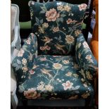 Edwardian Armchair, on tapered front legs and casters, green floral fabric.