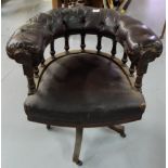 Late 19thC Swivel Armchair, the bowed and galleried top rail covered with black (worn) leather, on 4