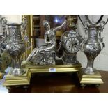 Three Piece Mantle Clock Set including a pair of silvered side urns on brass bases and a clock