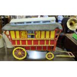 Painted Pine Model of Gypsy Caravan, painted red with yellow panels, on wheels, with removable roof,