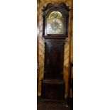 Geo. Grandfather Clock, the swan neck mounted hood enclosing a silvered dial with ornate brass