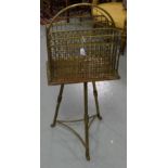 Edw. Brass newspaper rack with carrying handle, on a circular 3-legged brass base, 37”h