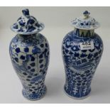 Two blue and white 1940’s porcelain vases with lids, each 13”h, decorated with blue foliage and