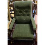 Edw. Walnut Armchair, on turned front legs with castors, green velvet covered button back.