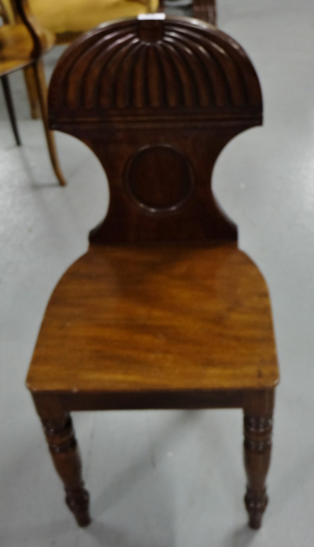 WMIV Mahogany Hall Chair, the domed and reeded top over turned front legs.