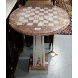 Circular marble table, the red and white top over tapered column, square base, 27”h x 19”w dia.
